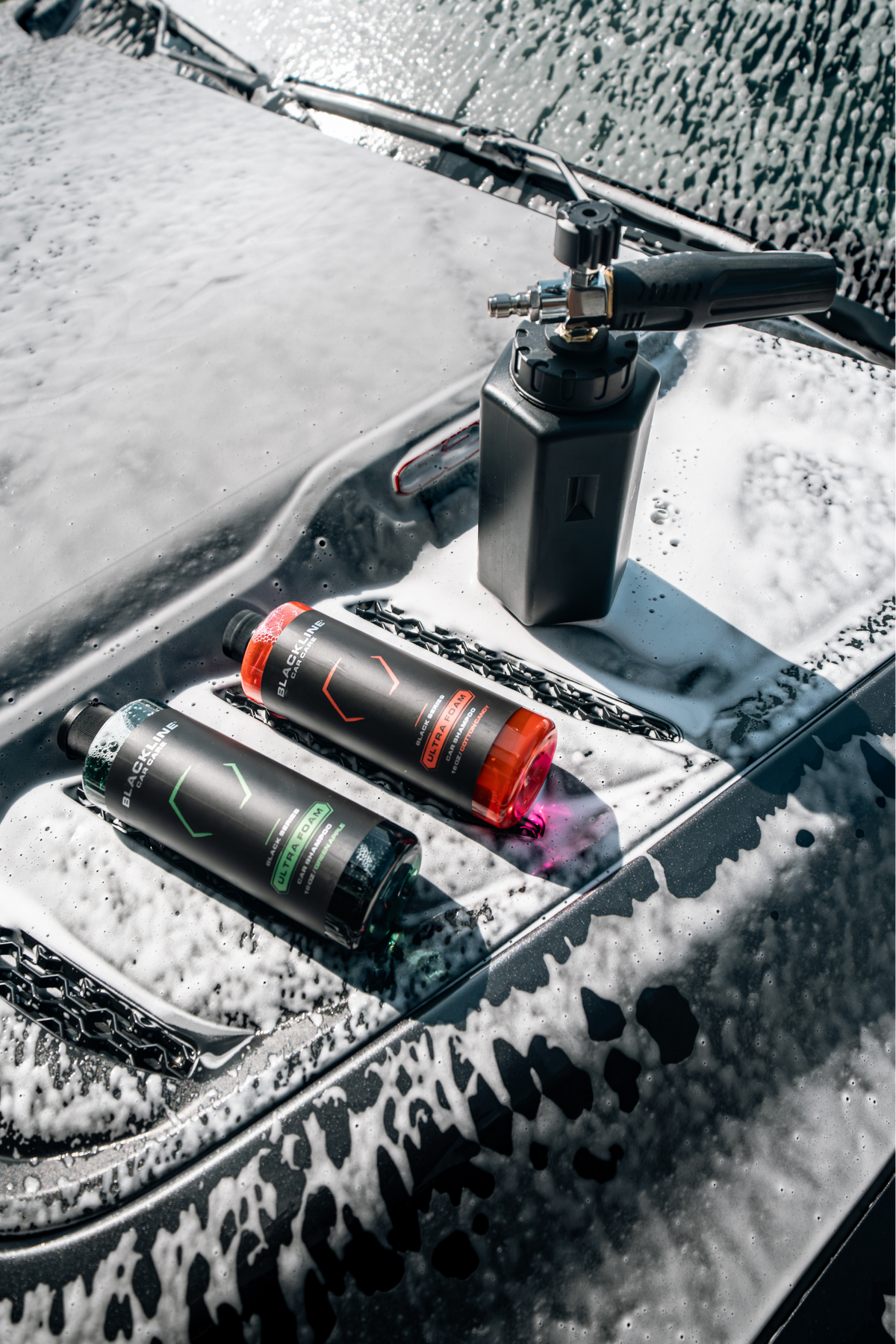 Two Blackline Ultra Foam 16oz bottles side by side, Cotton Candy pink and Green Apple green scents.