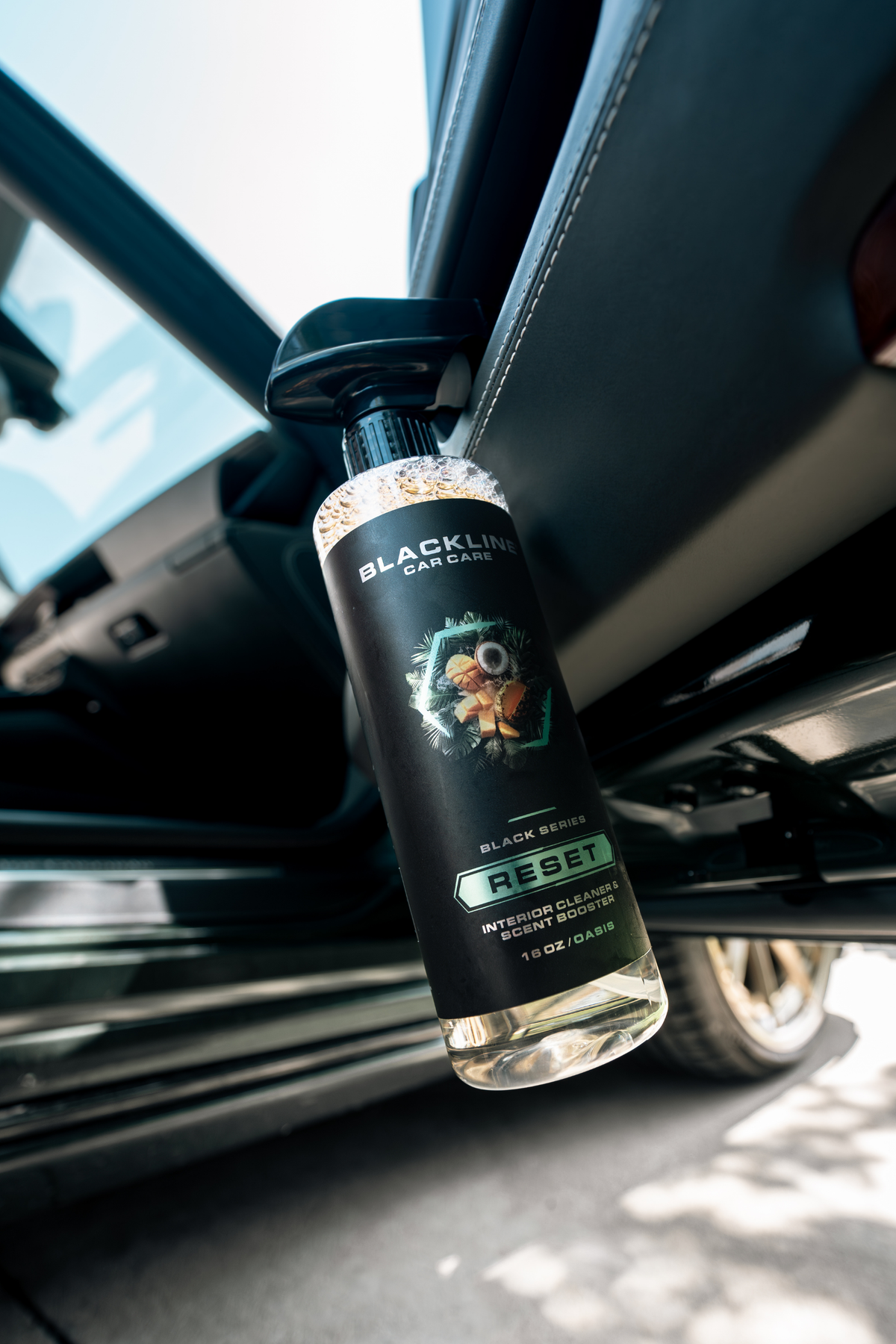 Close-up product shot of Blackline Reset in Oasis scent.