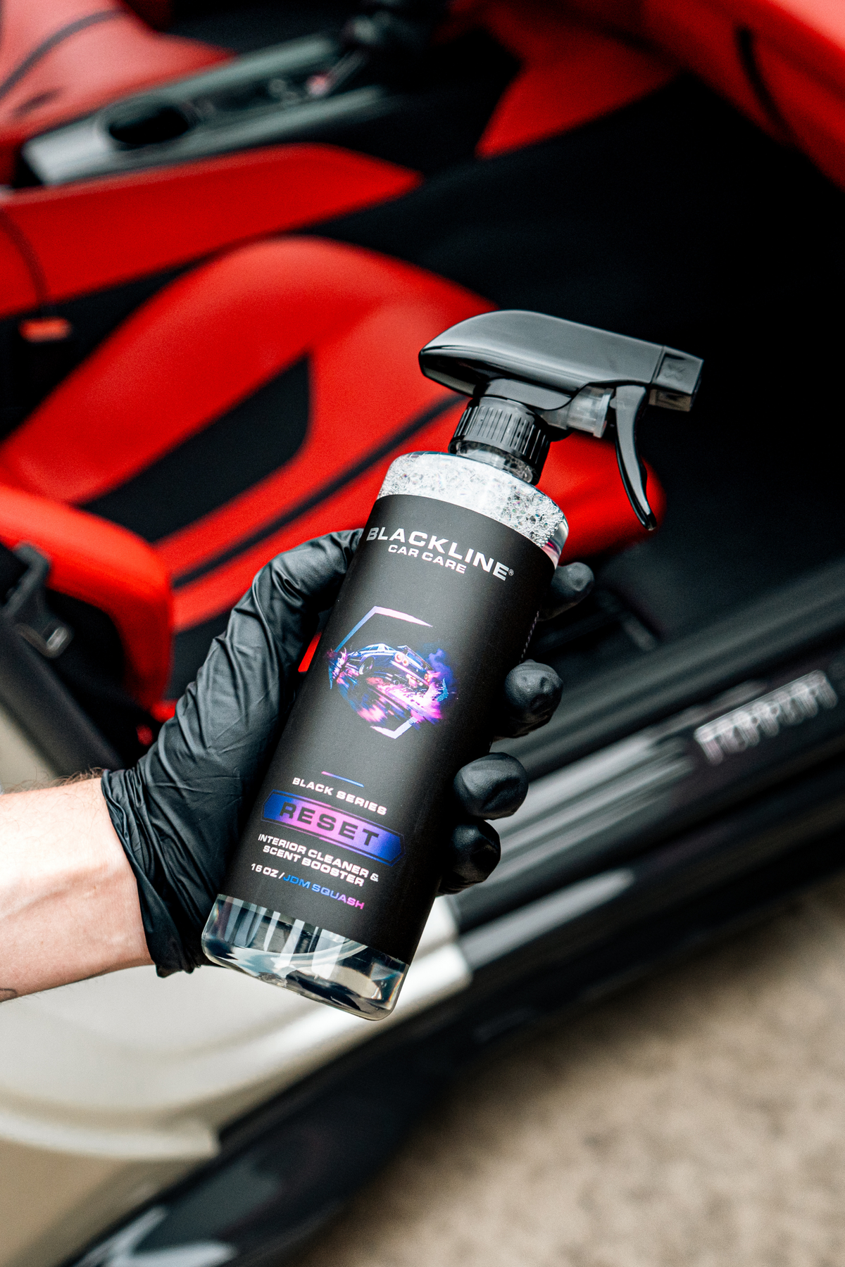 Blackline Reset JDM Squash interior cleaner spray bottle held in hand
