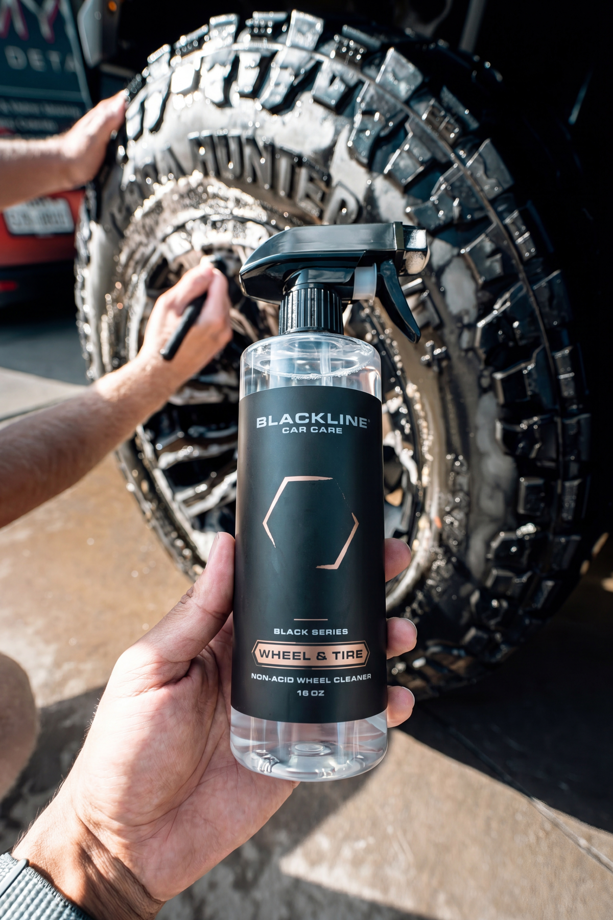 Blackline Wheel n Tire Cleaner being sprayed on a dirty wheel.