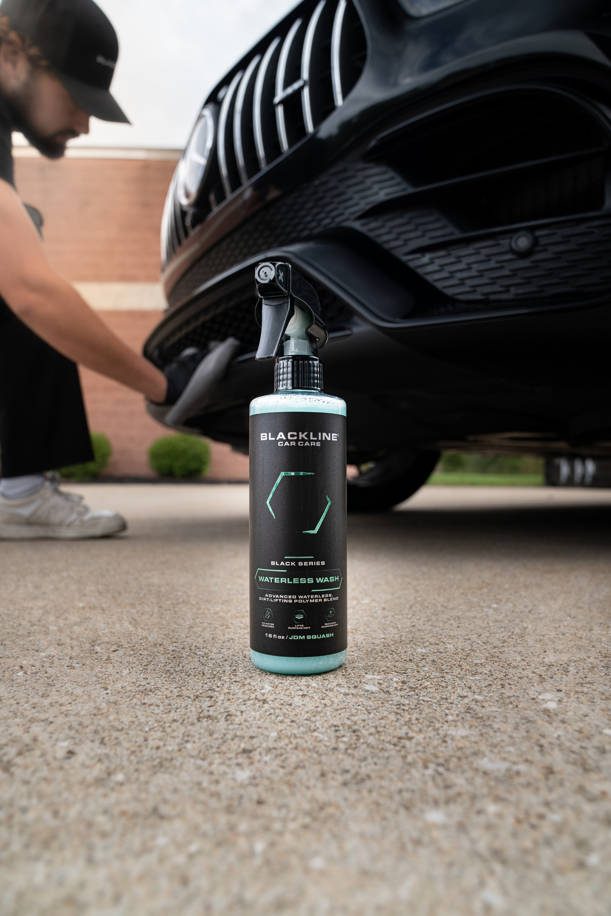 Blackline Waterless Wash spray bottle side view on dark background showing bottle profile
