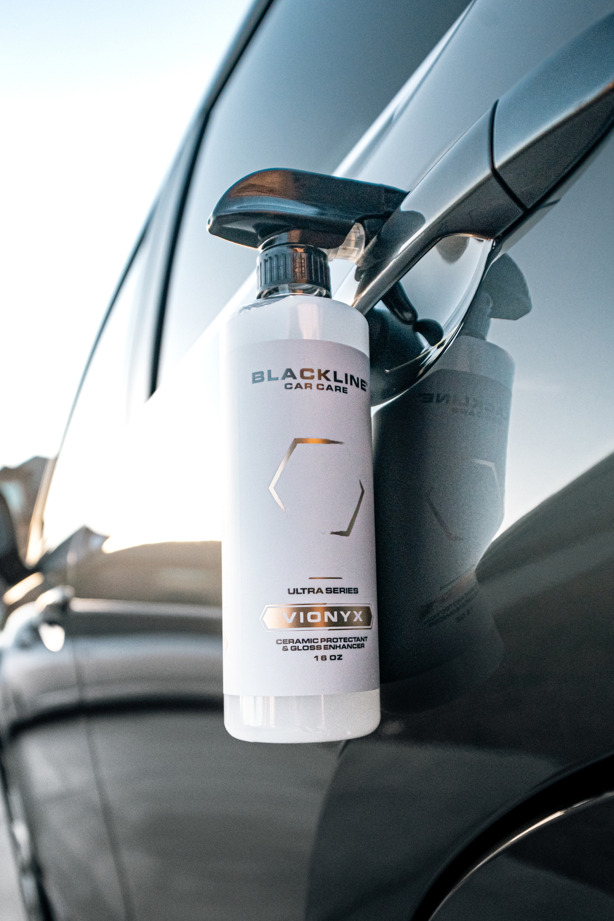 Water beading on car paint protected by Blackline Vionyx ceramic spray.