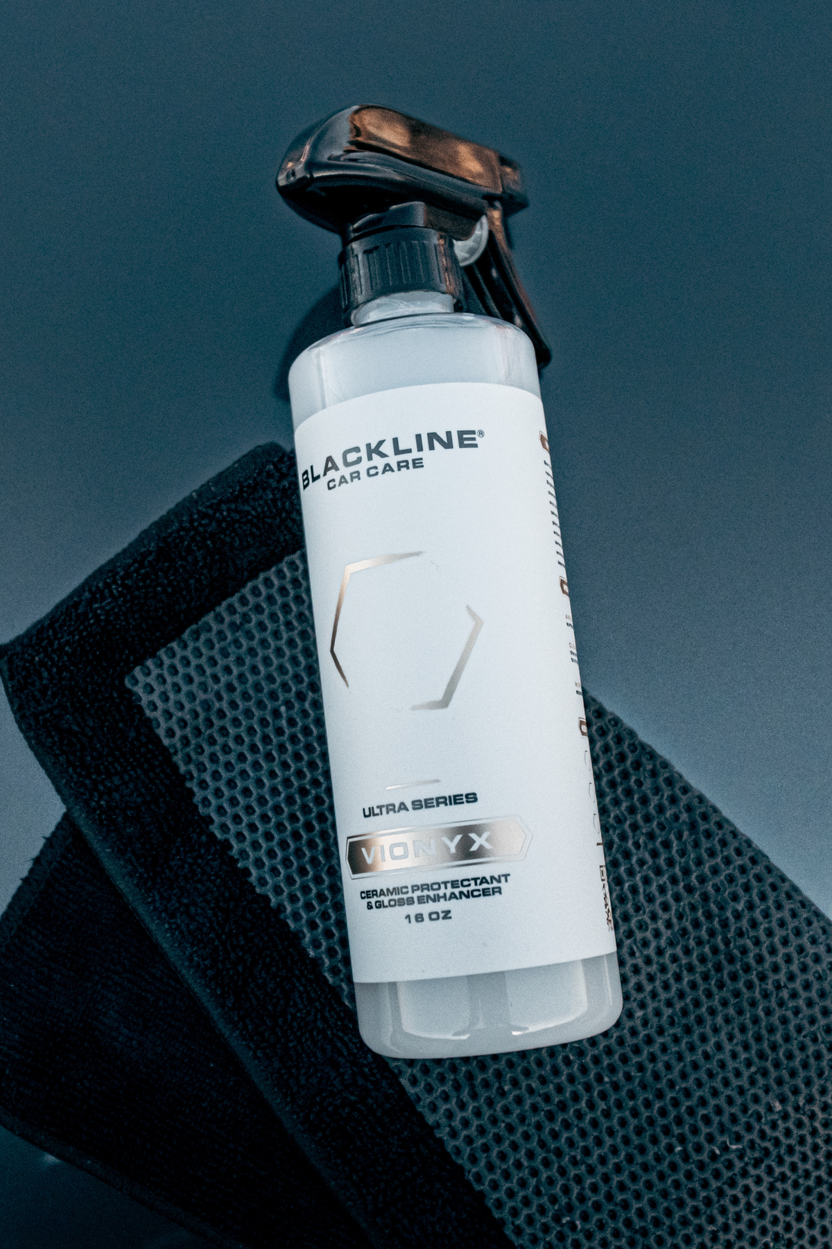 Detail shot of Blackline Vionyx ceramic protectant finish on car paint.