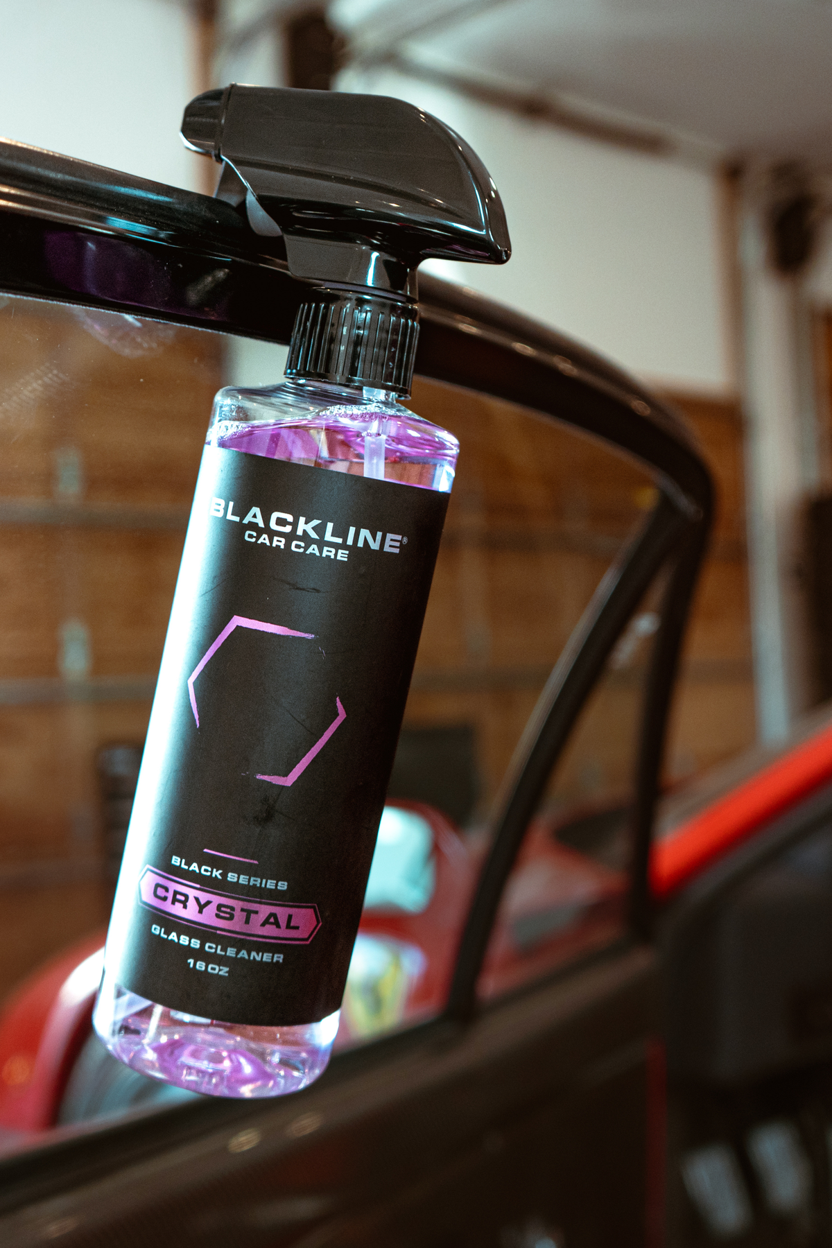 Streak-free finish on a side window after using Blackline Crystal Glass Cleaner.