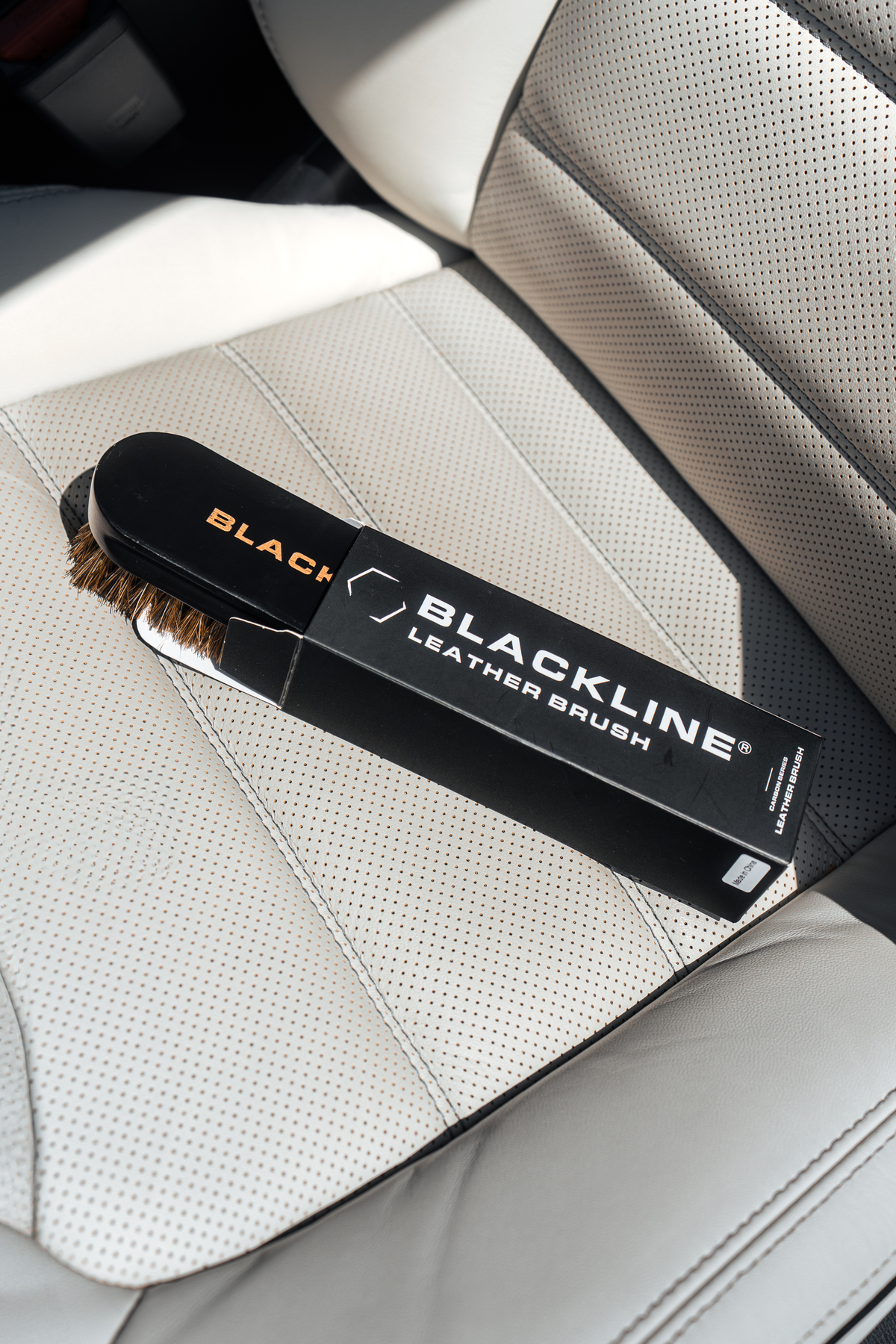 Close-up of the Blackline Leather Brush bristles during use.