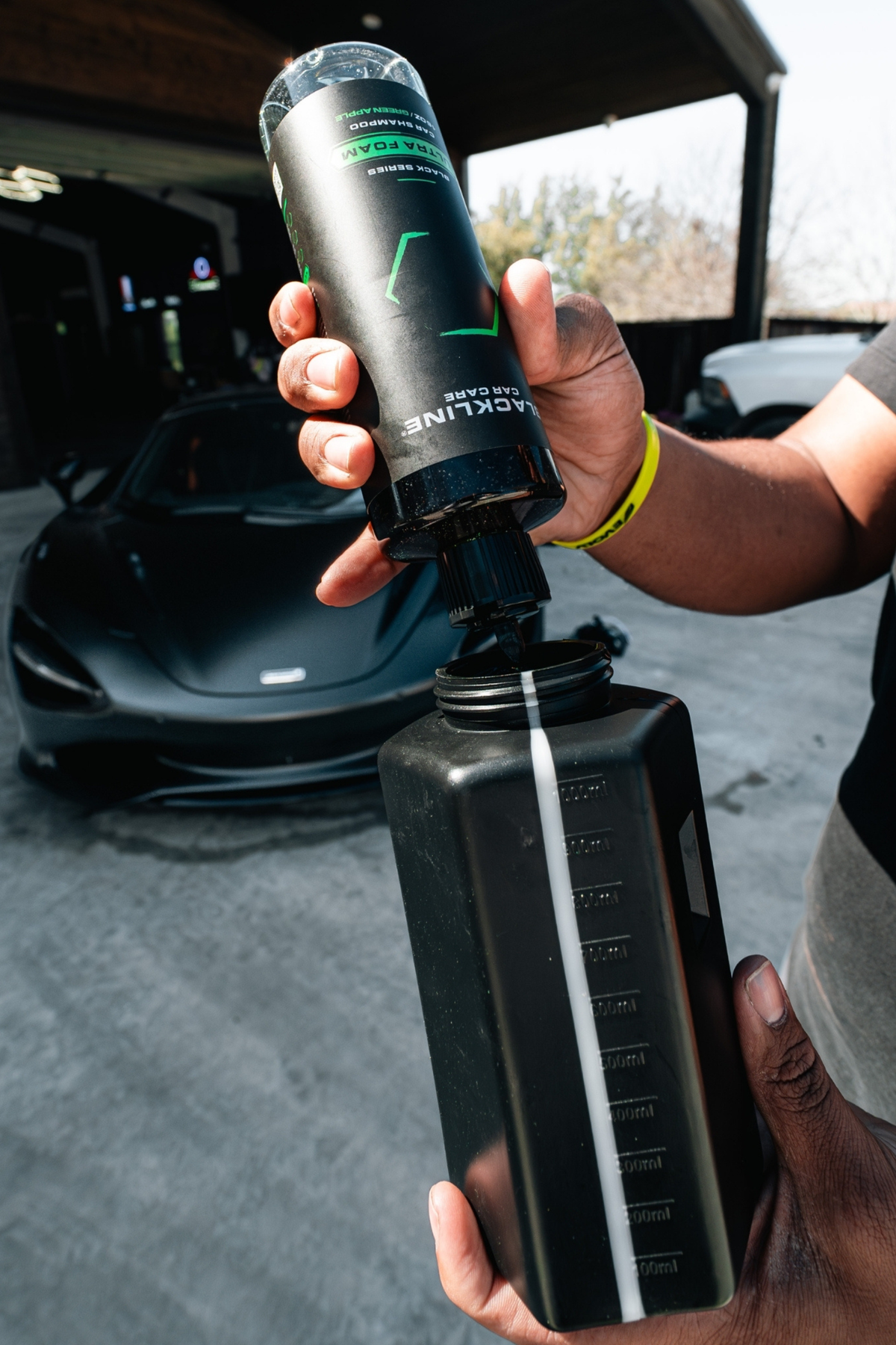 Blackline Blackout Kit applicator pad in use on a tire.