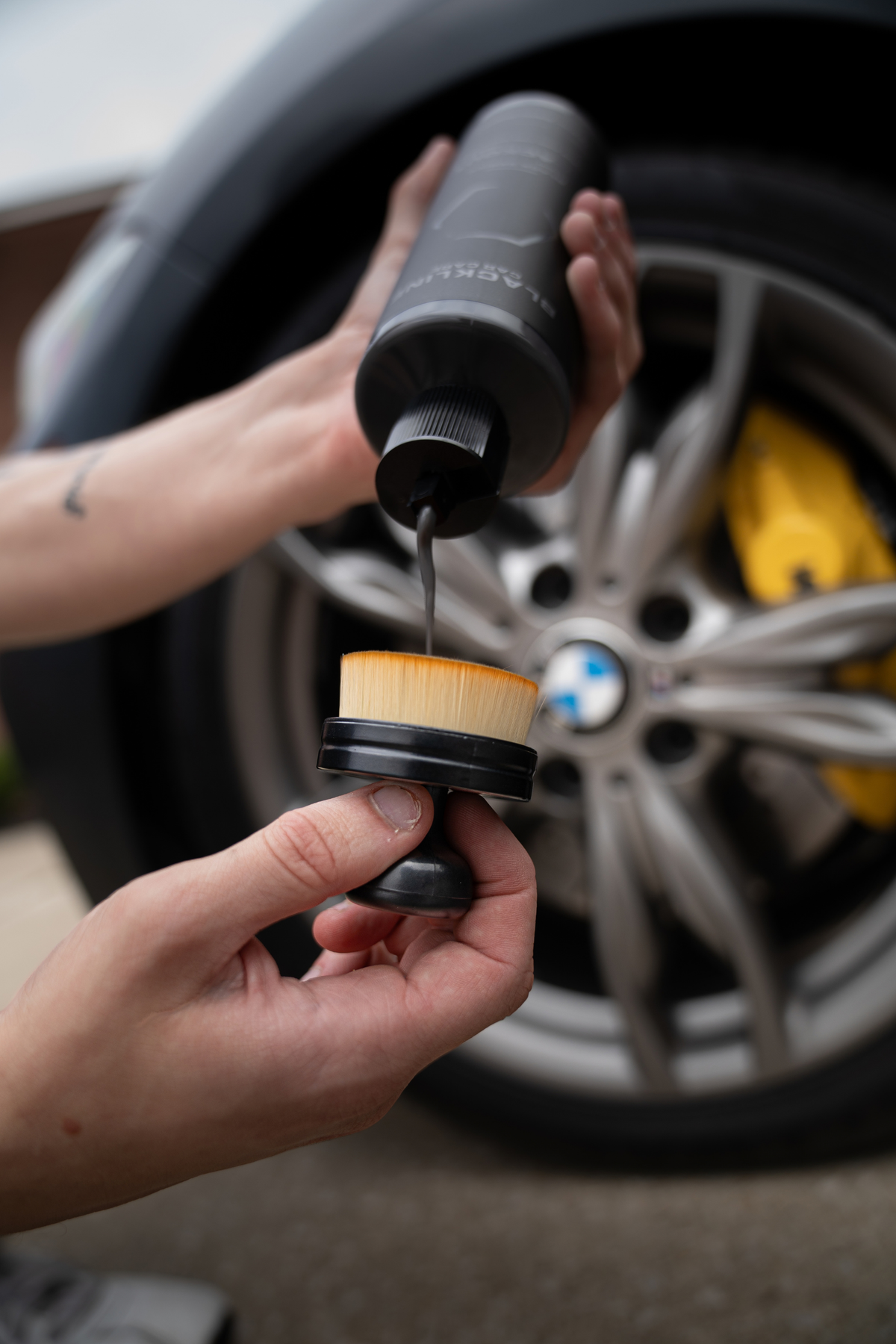 Blackline Tire Shine Applicator Brush angled view showing foam applicator head and ergonomic handle