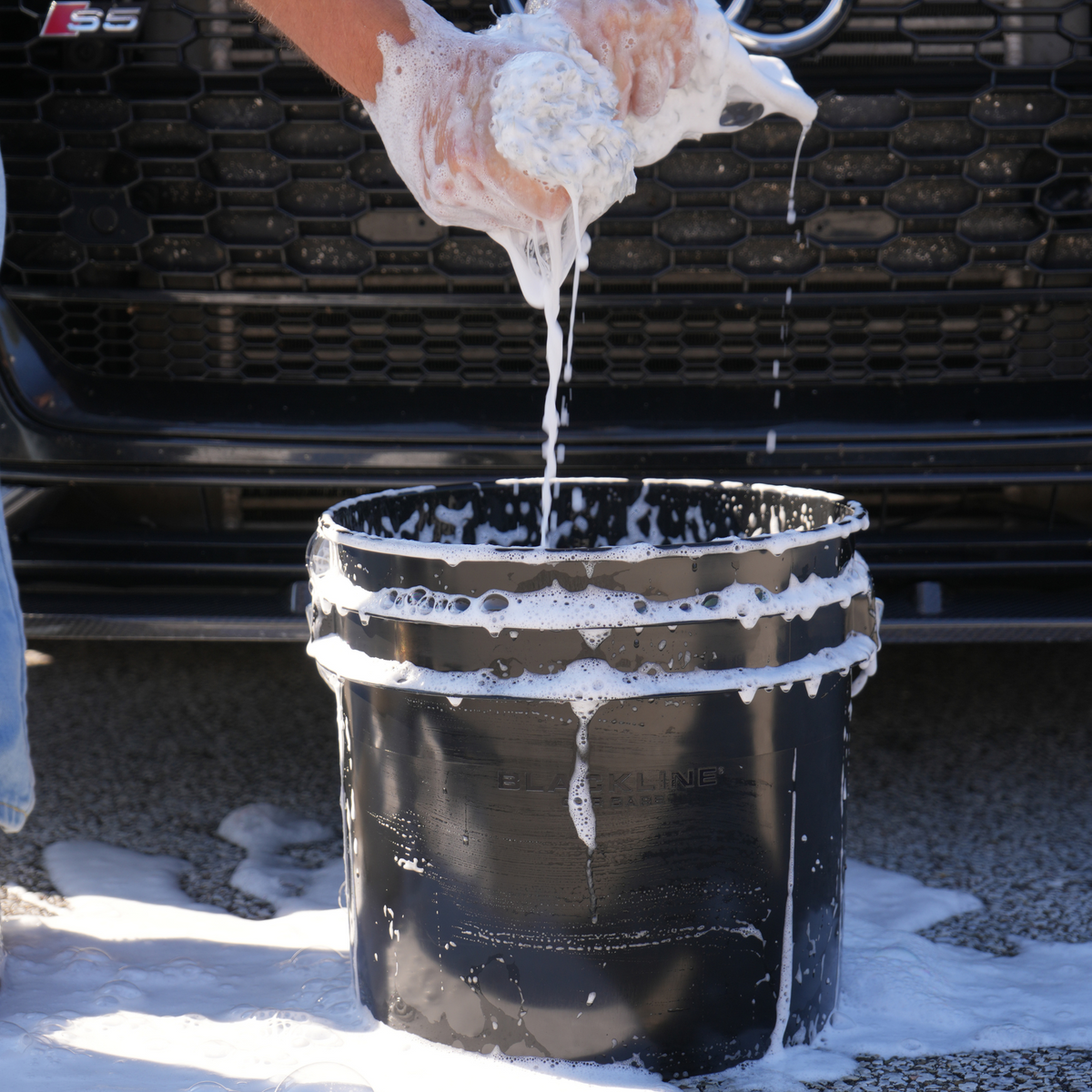 Blackline wash bucket side view with logo embossed.