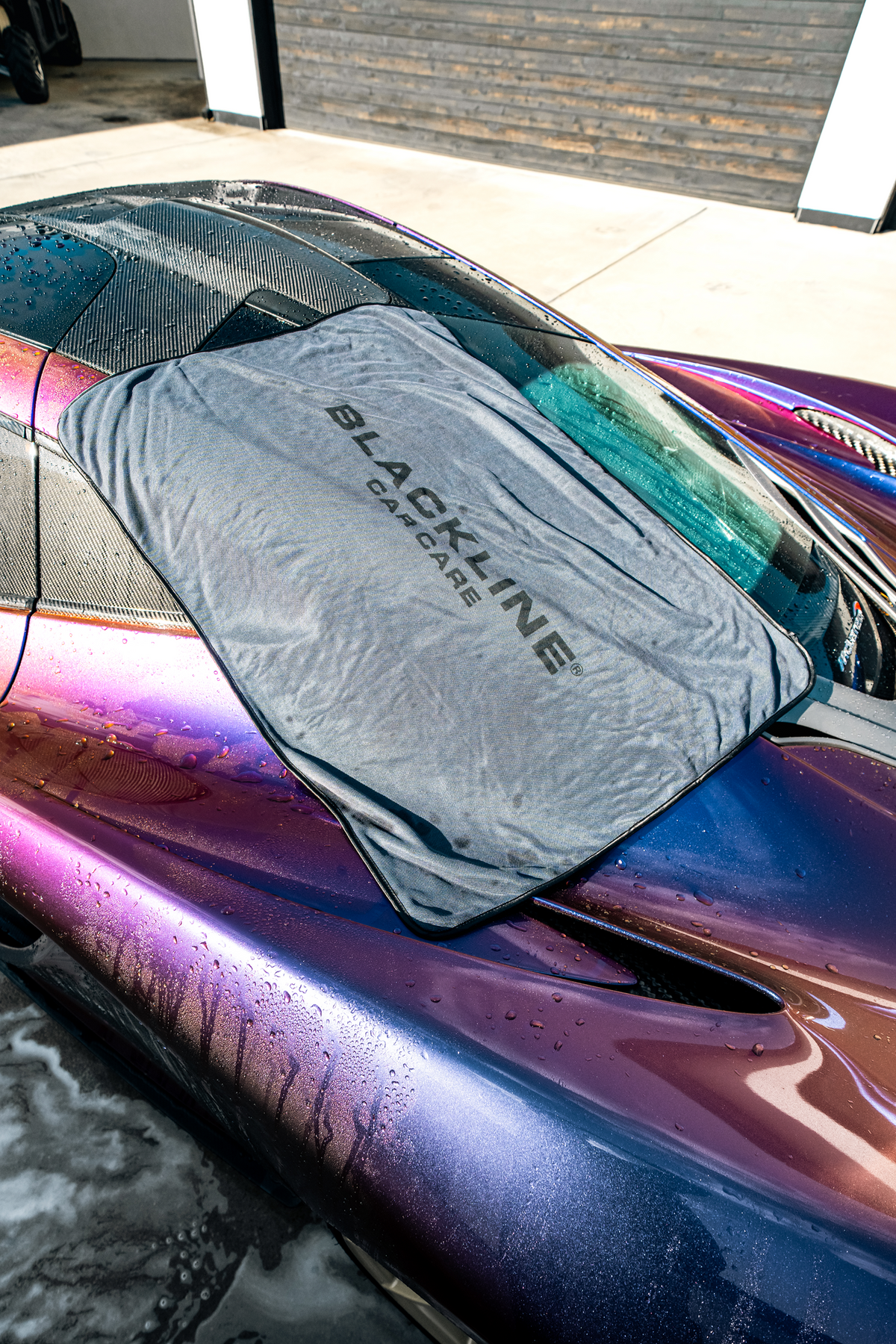 Lifestyle shot of the Blackline Slim Drying Towel in detailing bay.
