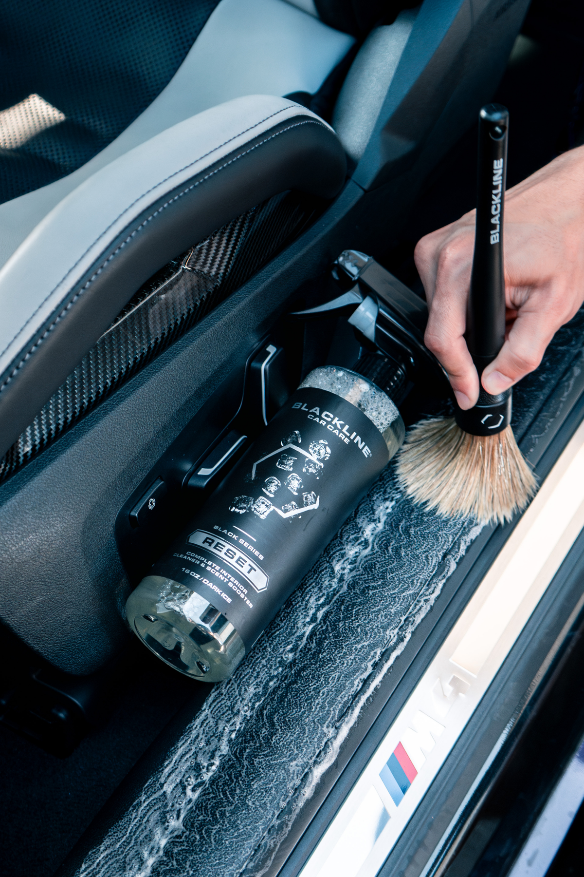 Blackline Reset in Dark Ice scent paired with a boars-hair detailing brush.
