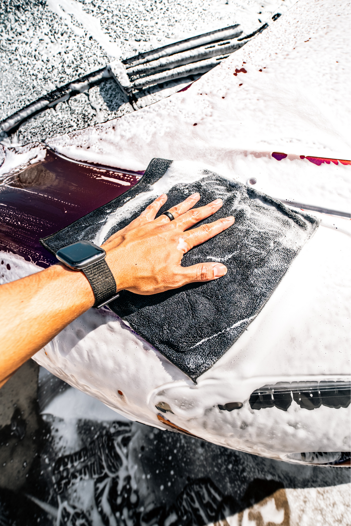 Blackline Synthetic Clay Towel being used to decontaminate vehicle paint.
